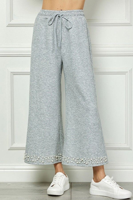 Textured Pearl Hem Cropped Pants sold by A Velvet Window