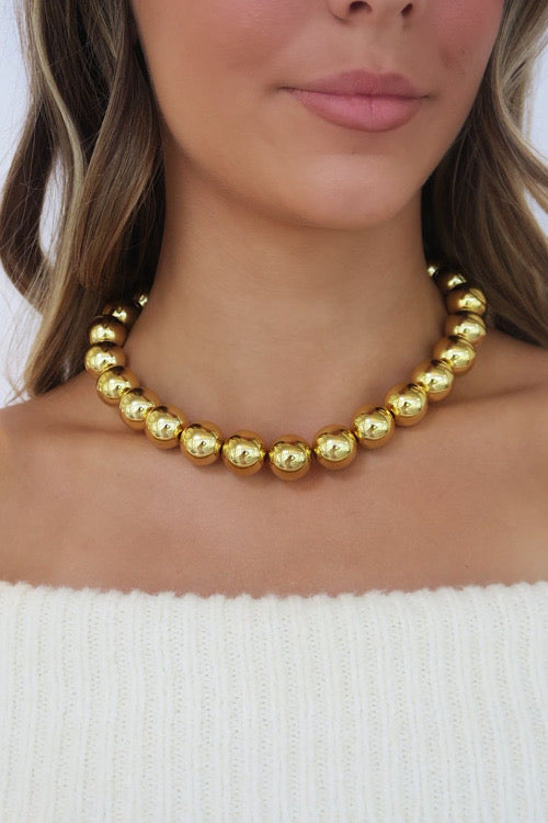 Golden Sphere Necklace sold by A Velvet Window